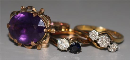 Two 18ct gold gem set rings and one 14ct gold and amethyst ring.